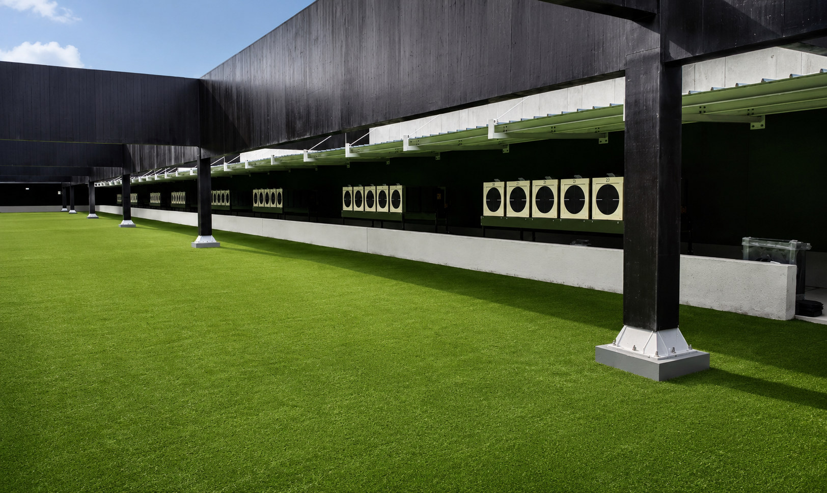 Completed outdoor shooting range with covered target lanes
